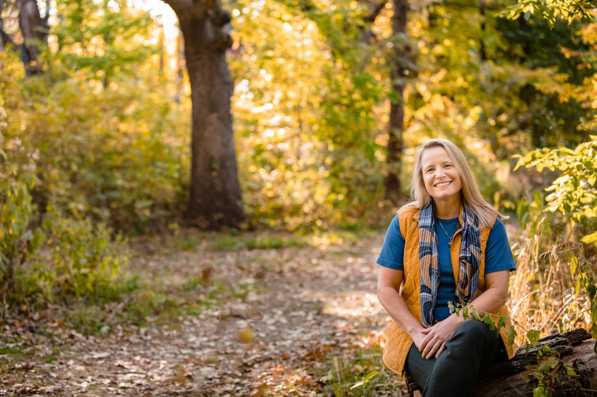 photo of Anke sitting among trees